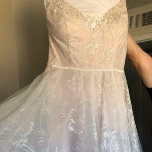 Wedding dress from David’s bridal. Size 14. Worn once for 2 hours.
